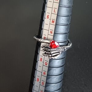 Skeleton Hand Ring with Red Heart Gem (NEW)